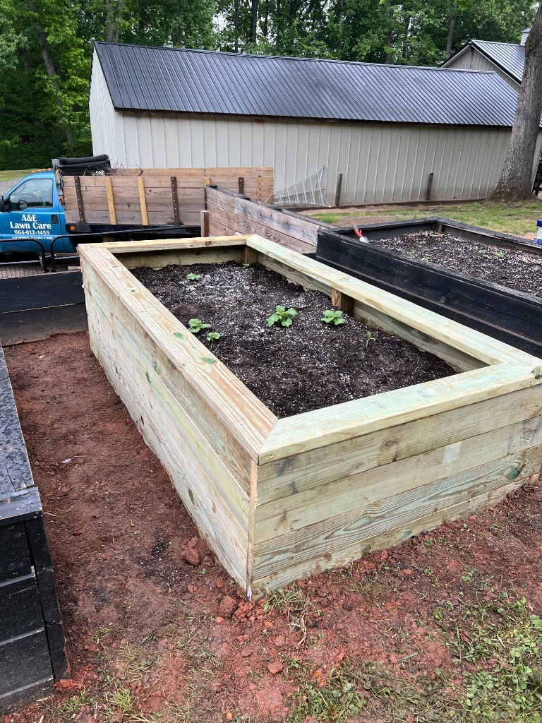 Large black drainage pipe on trailer ready for property installation